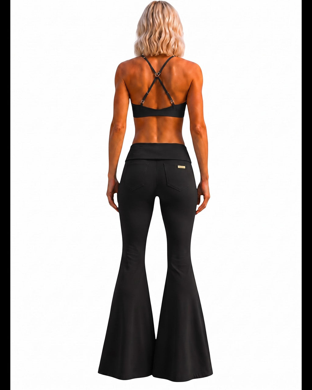 Back view of a blonde model wearing Phural She Did It Anyway Flares in Black Card with a high waistband and back pockets