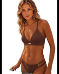 Model wearing Phural brown bikini bottoms with adjustable side straps and gold hardware, paired with matching top.