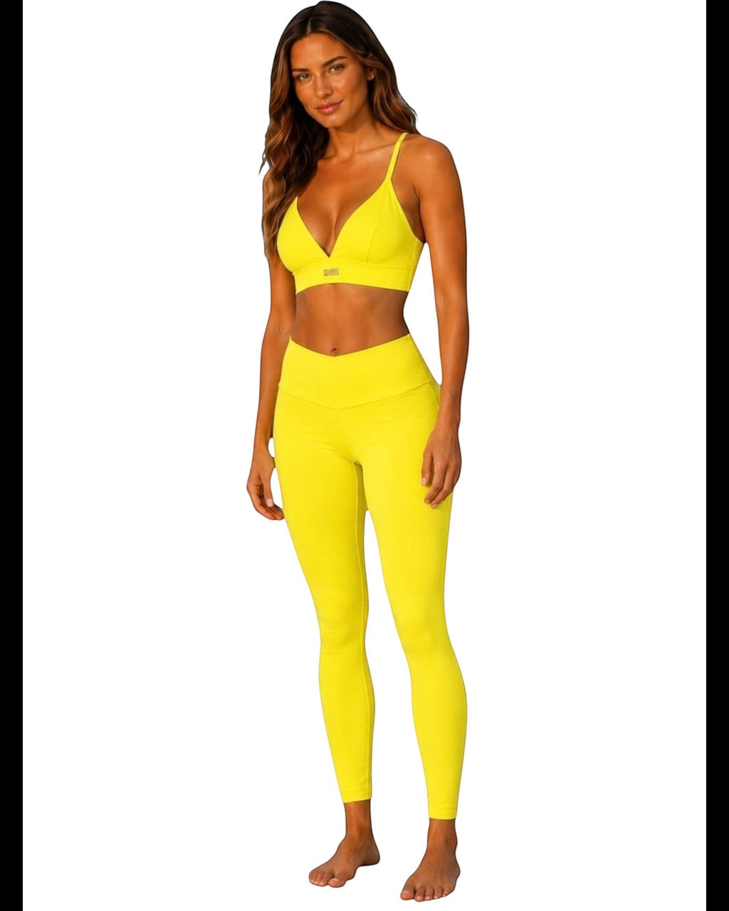 Phural Cardio to Cabana convertible bra-kini top in bright yellow worn by a model with matching leggings.