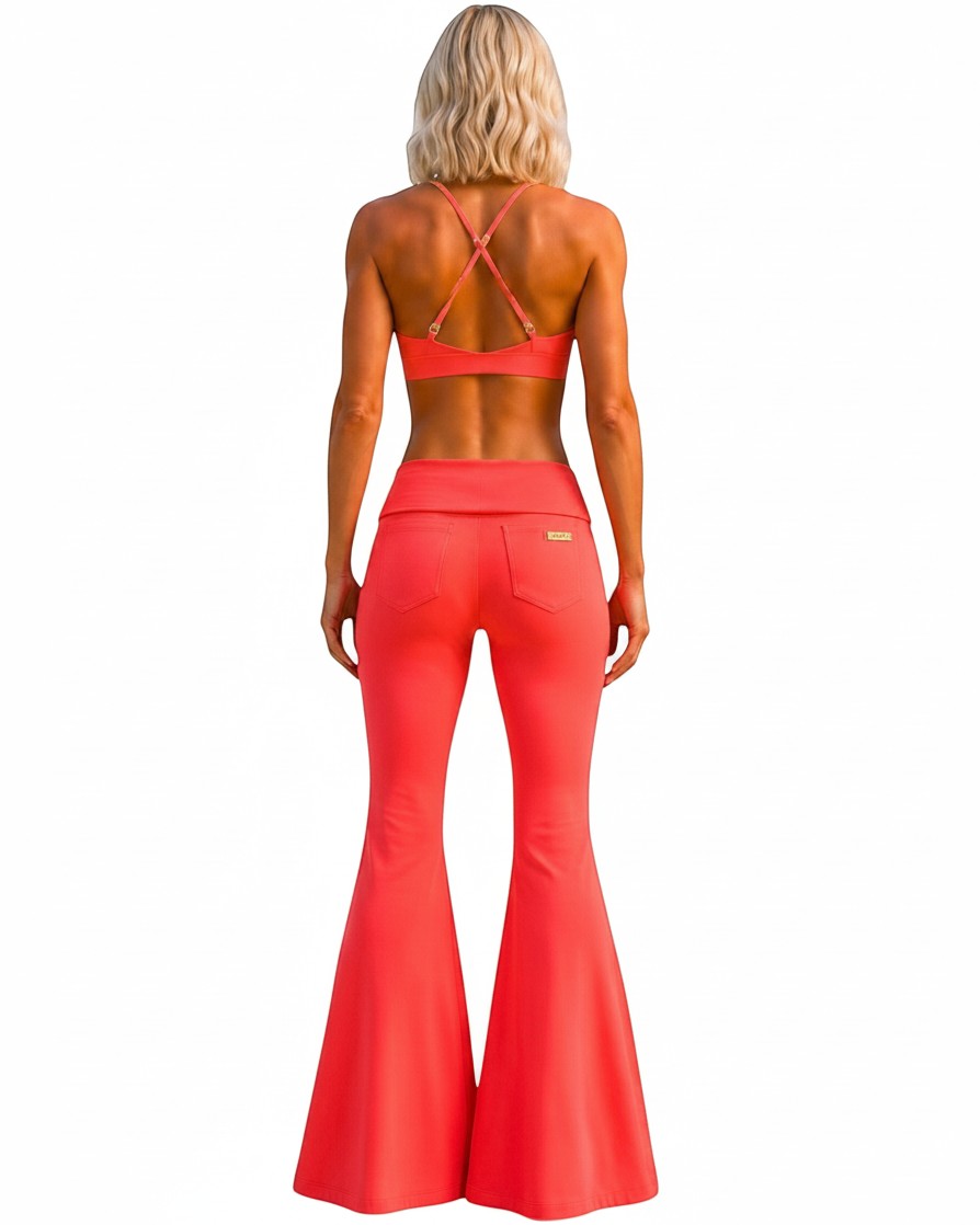 Phural She Did It Anyway Flares in Coral Riviera, a high-compression nylon-spandex wide-leg pant with back pockets.