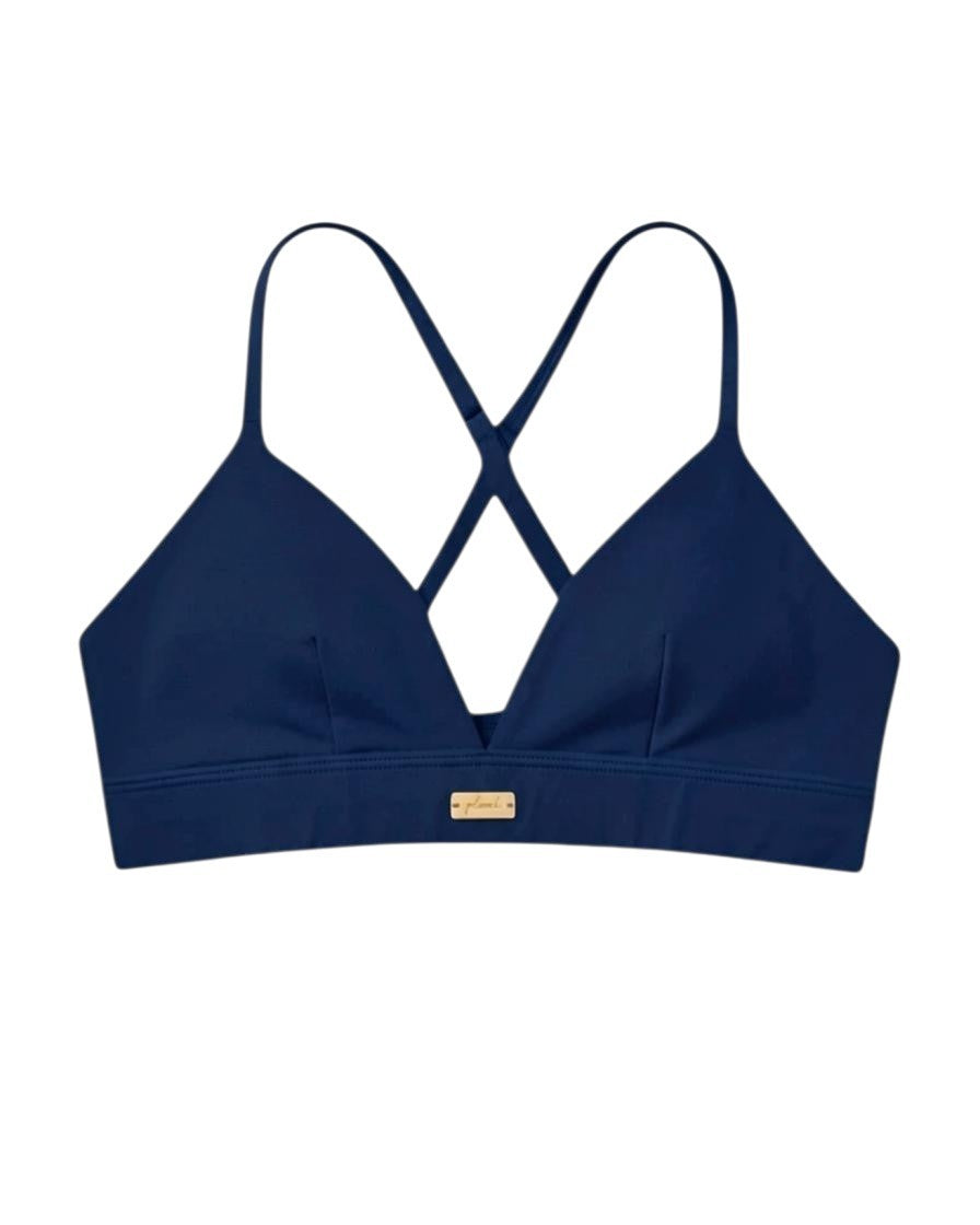 Navy Cardio To Cabana bikini top with a V-neckline and small gold-tone Phural tag, shown from the front.