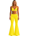 A model wearing Phural She Did It Anyway Flares in Yacht Club Yellow with a matching high-compression sports bra.