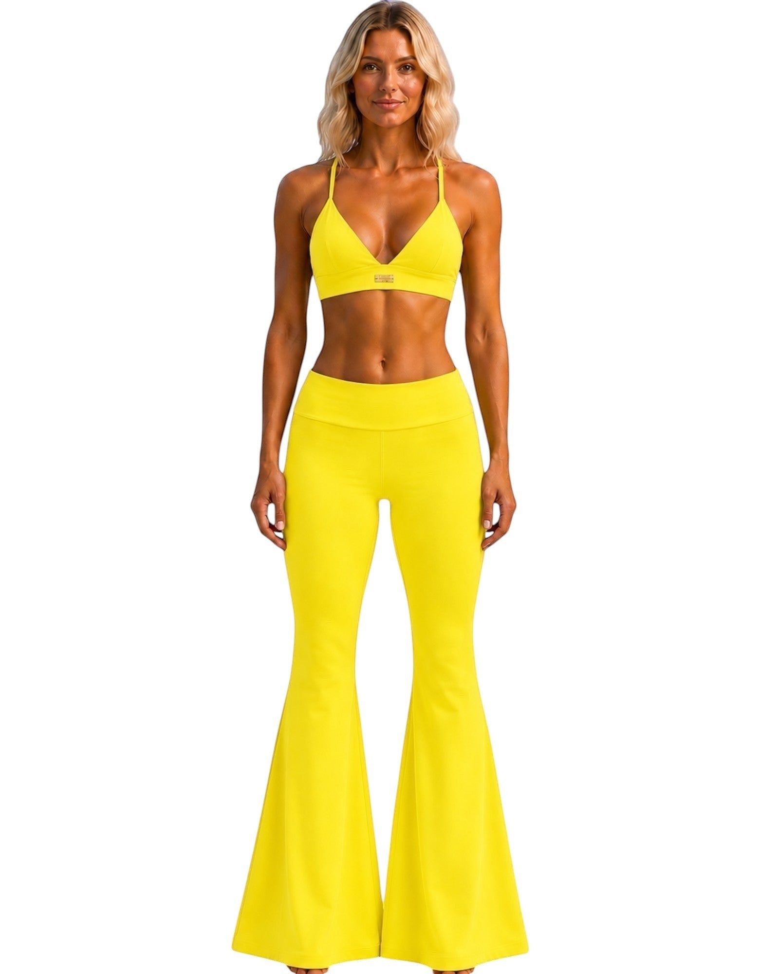 A model wearing Phural She Did It Anyway Flares in Yacht Club Yellow with a matching high-compression sports bra.