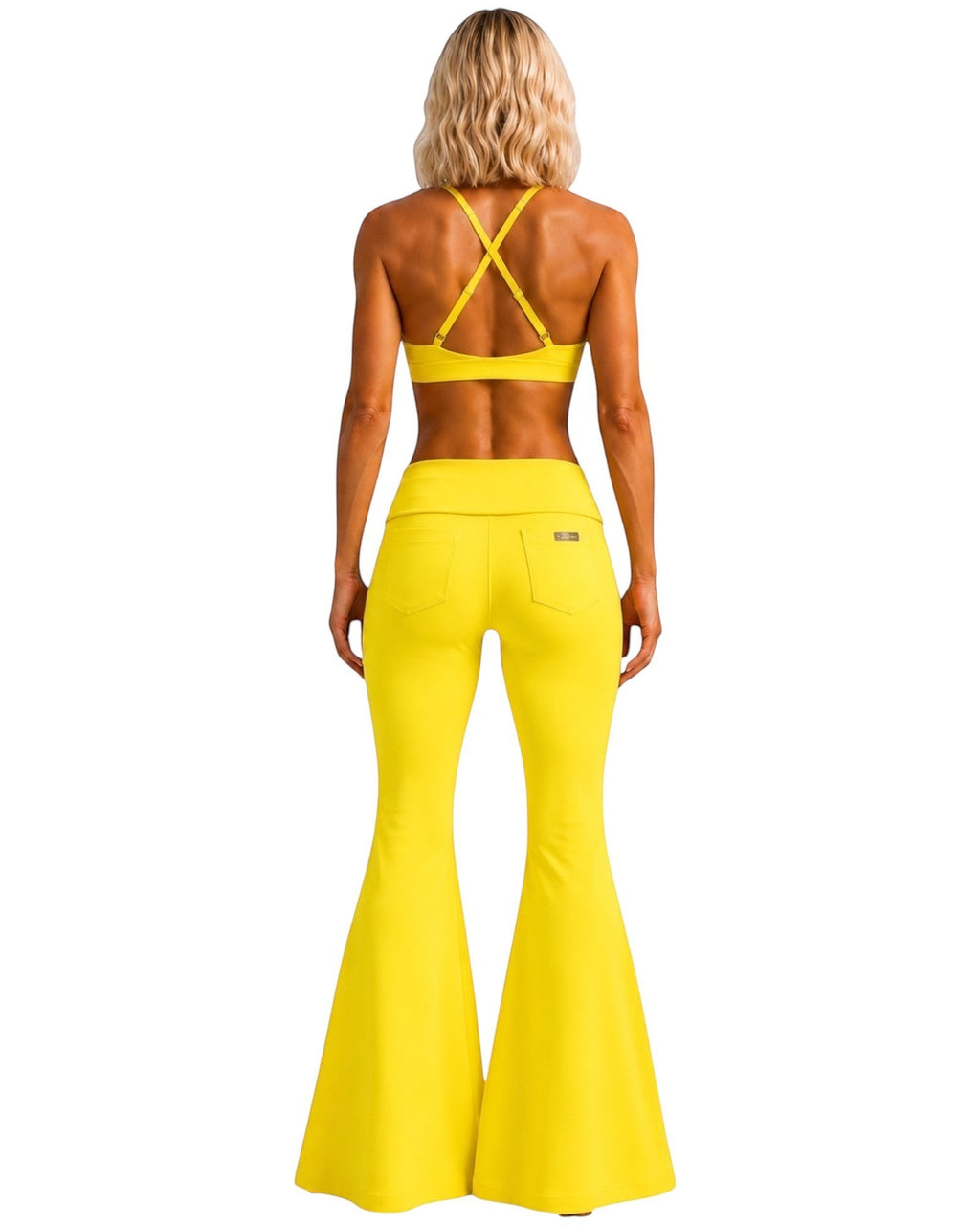 Phural She Did It Anyway flare pants in Yacht Club Yellow, featuring a high-compression nylon-spandex wide-leg design.