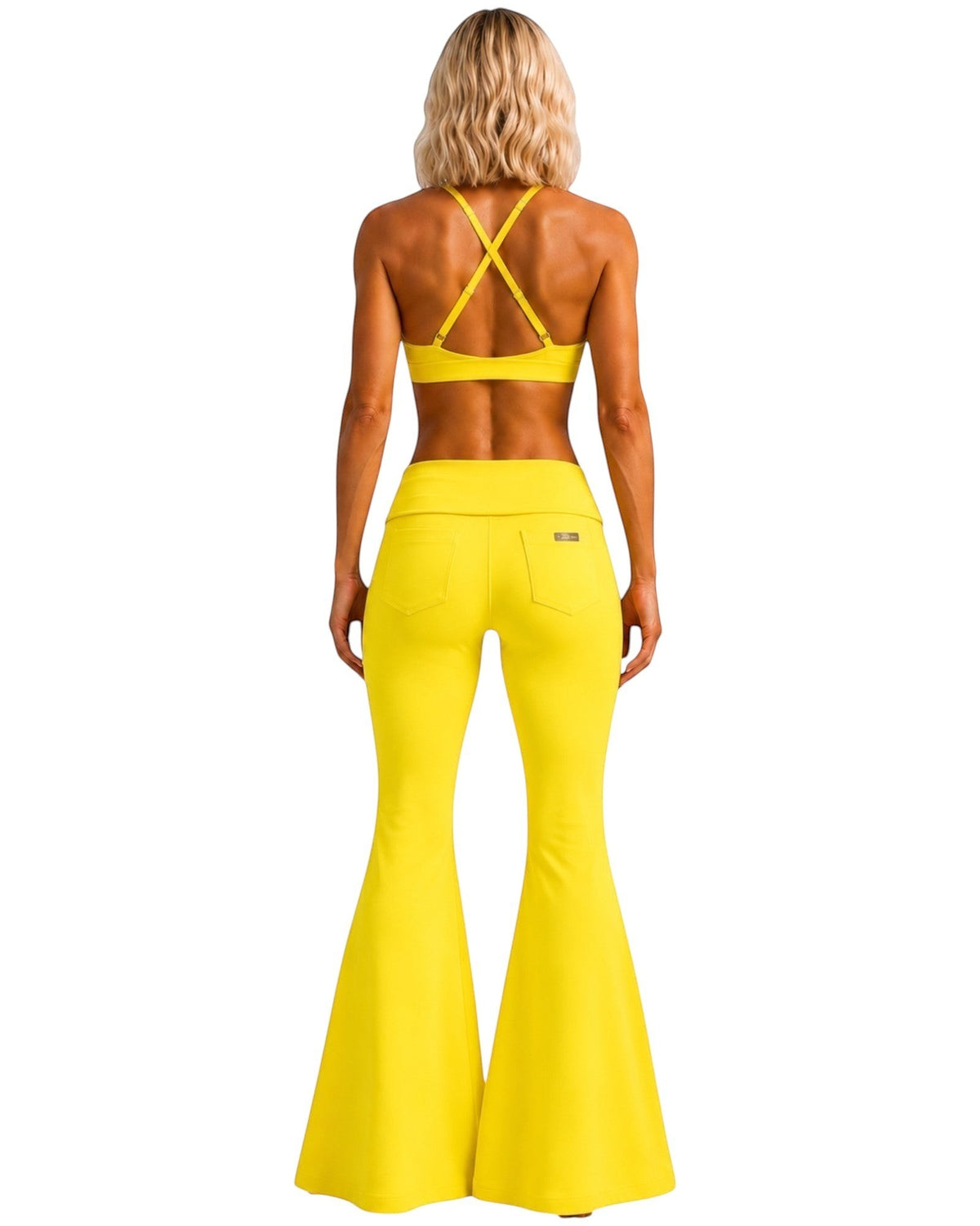 Phural She Did It Anyway flare pants in Yacht Club Yellow, featuring a high-compression nylon-spandex wide-leg design.