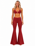 Phural's blonde model wearing Rouge Noir She Did It Anyway Flares and matching bra-kini, front view showing the low-rise fold-over waistband.